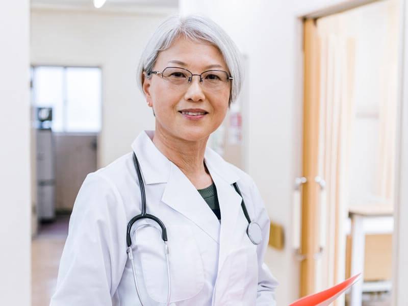 Senior Asian woman doctor in a clinic