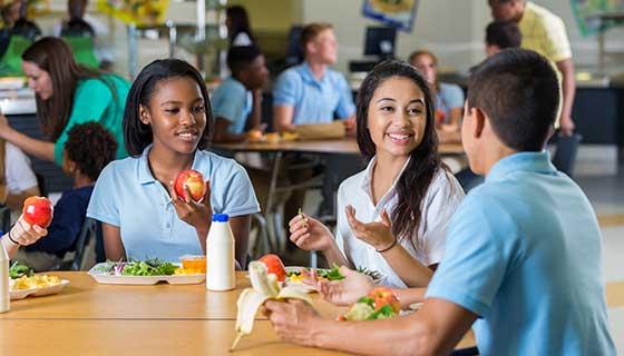 teens eating during school lunch